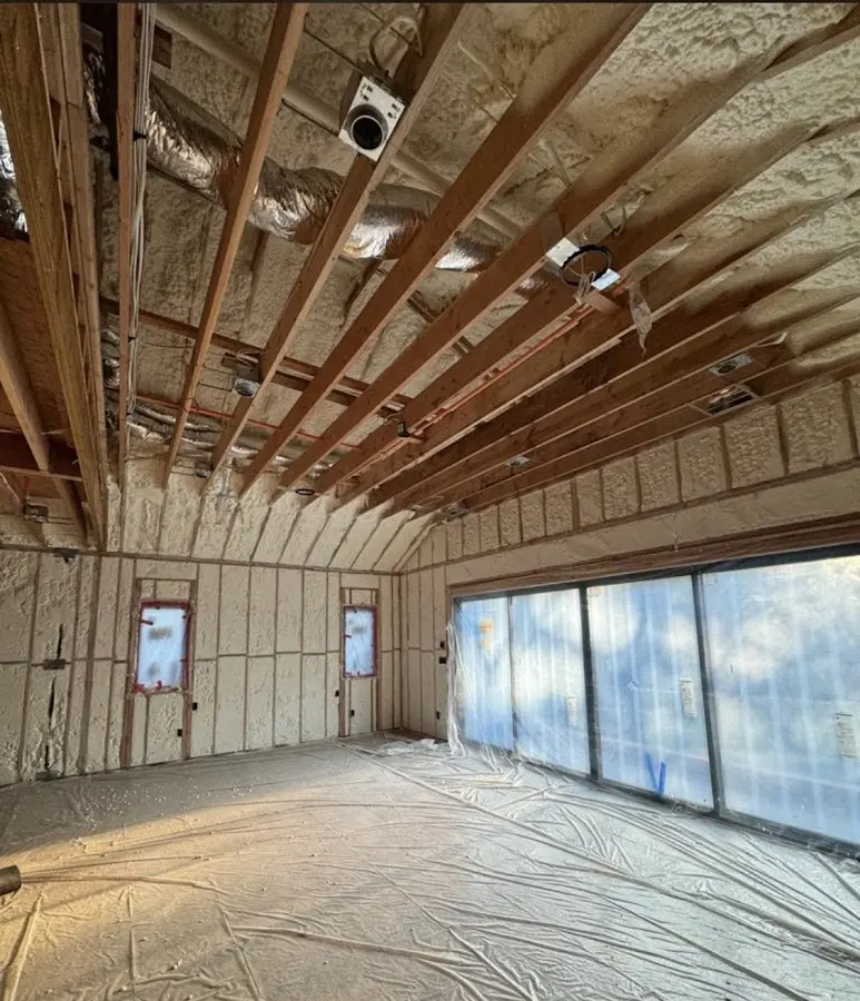 Interior walls and ceiling insulated with spray foam during new construction in Starkville